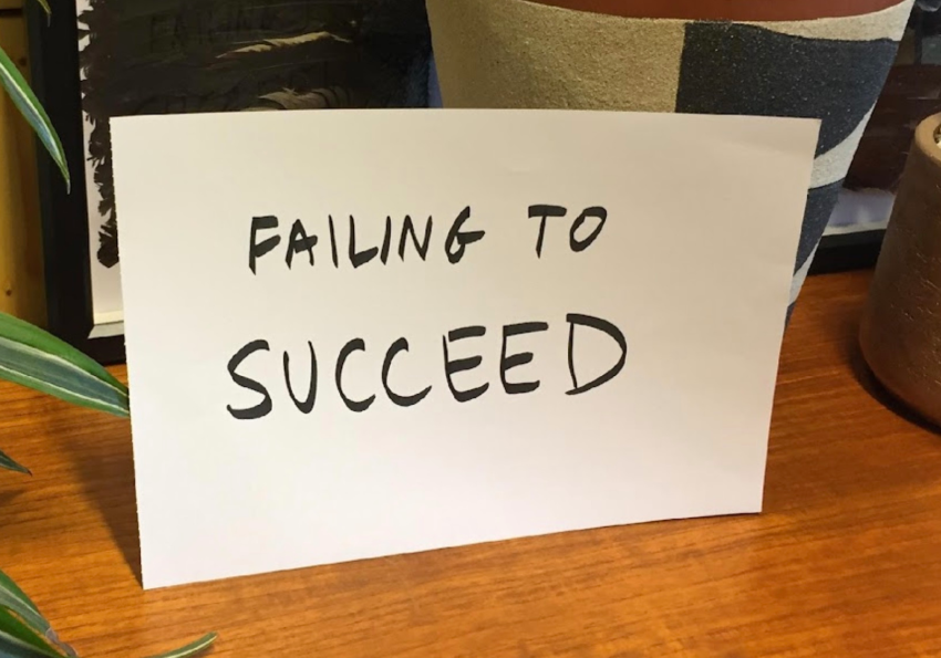 Handwritten paper that says "Failing to succeed"